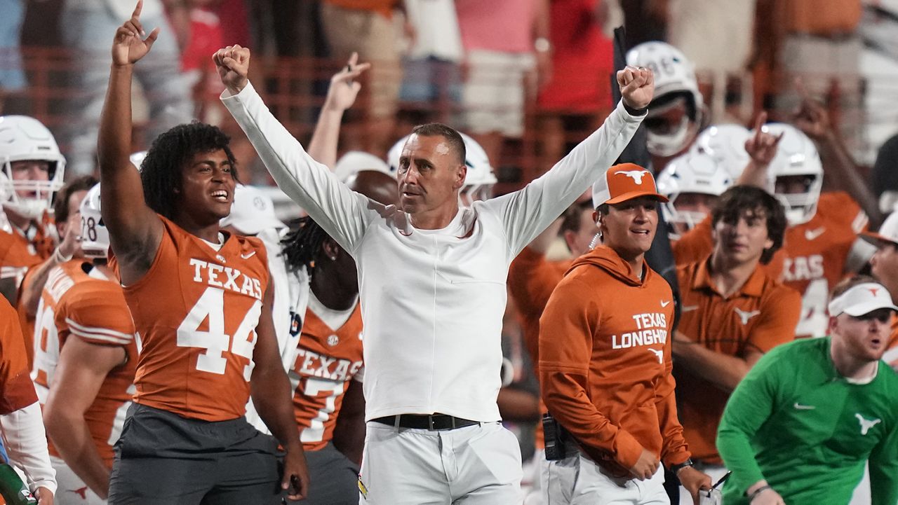 Texas head coach Steve Sarkisian, center, celebrates Texas' win over Ohio State in an NCAA college football game in Austin, Texas, Saturday, Sept. 12, 2026. (AP Photo/Eric Gay)