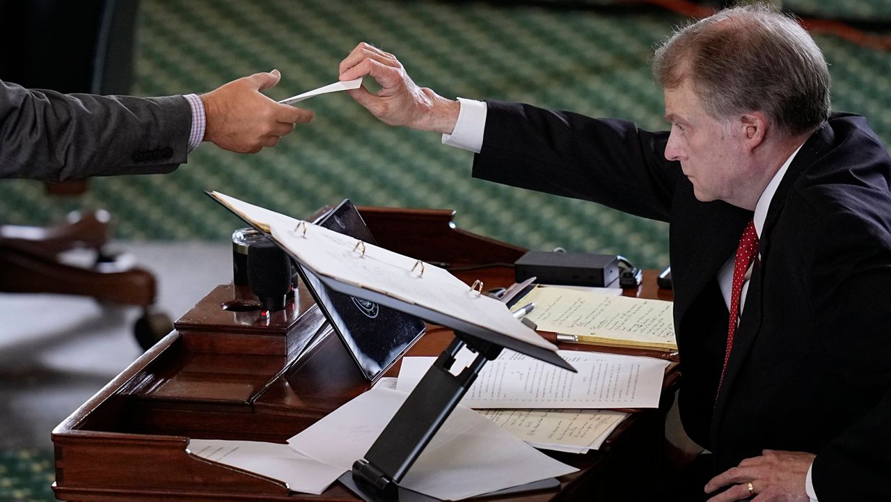 Texas state Sen. Brian Birdwell acting as a juror votes on the articles of impeachment against suspended Texas Attorney General Ken Paxton in the Senate Chamber at the Texas Capitol, Saturday, Sept. 16, 2023, in Austin, Texas. (AP Photo/Eric Gay)
