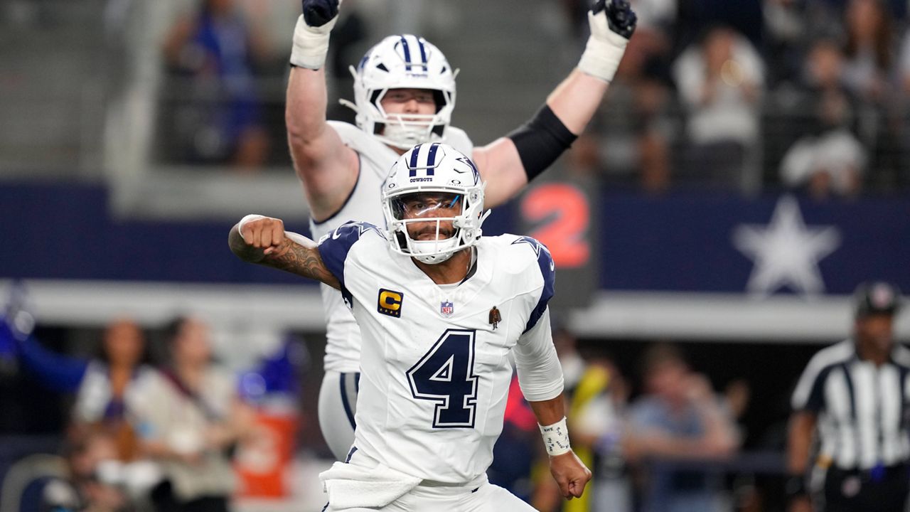 Dallas Cowboys quarterback Dak Prescott (4) celebrates after throwing a pass for a touchdown against the Washington Commanders in the second half during an NFL football game in Arlington, Texas, Sunday, Sept. 20, 2026. (AP Photo/Tony Gutierrez)
