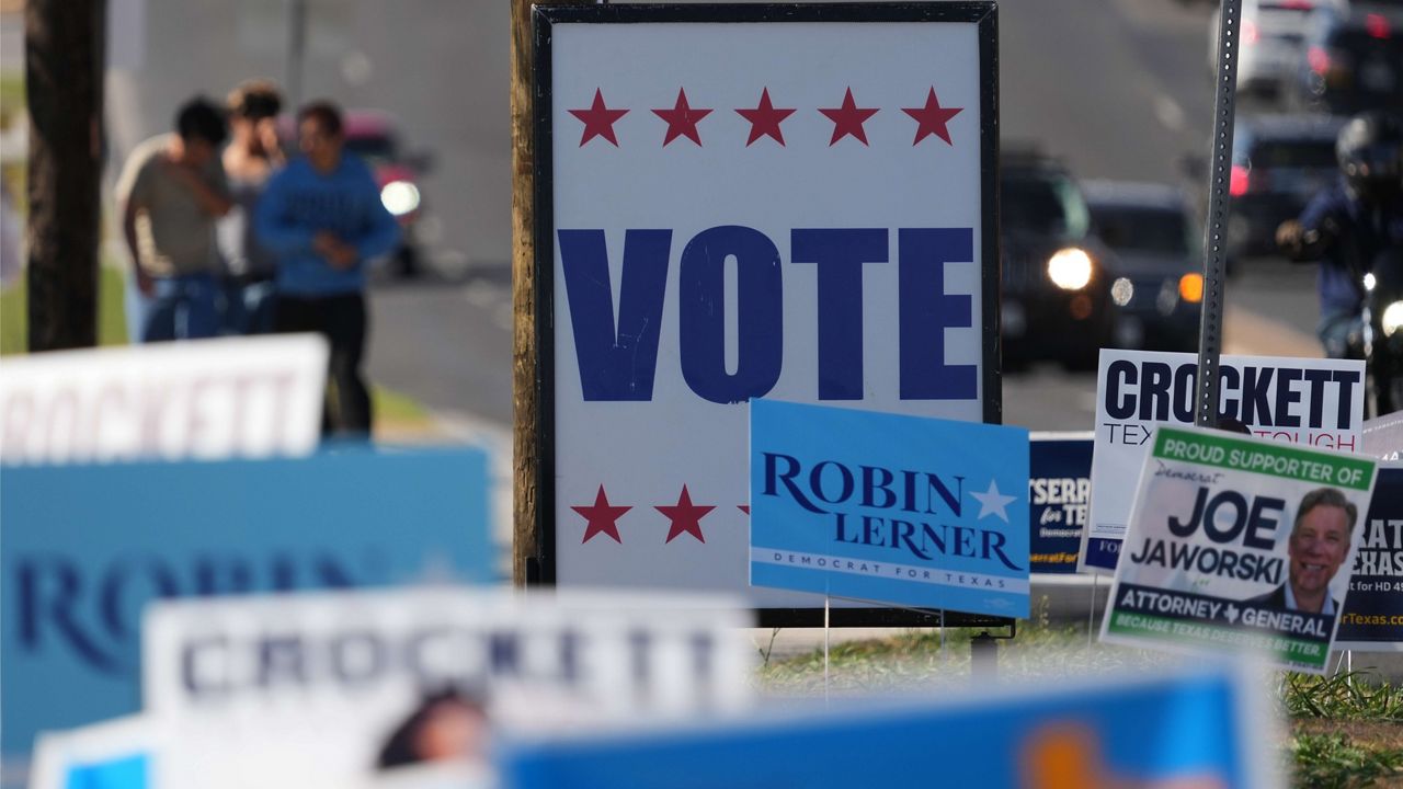 Election signs crowd an intersection near a polling place, in Austin, Texas, Tuesday, Feb. 17, 2026. (AP Photo/Eric Gay)