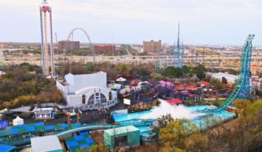 Six Flags Over Texas theme park in Arlington, Texas, with roller coasters visible behind the park’s Six Flags branding.