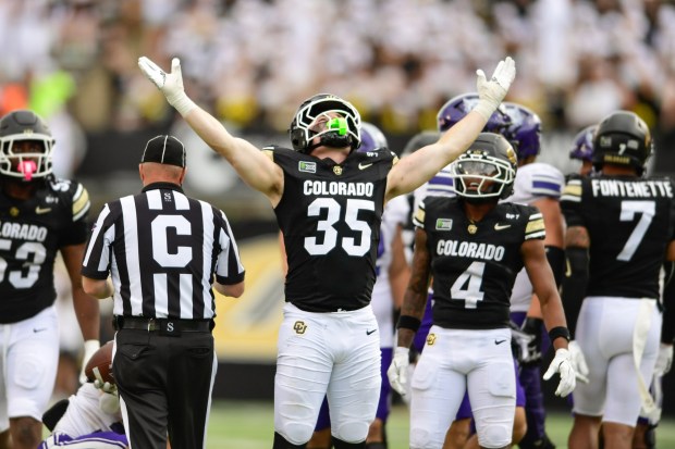 Colorado Buffaloes linebacker Tyler Martinez, center, celebrates tackling the Weber State Wildcats quarterback at Folsom Field in Boulder on Saturday, Sept. 12, 2026. (Matthew Jonas/Staff Photographer)