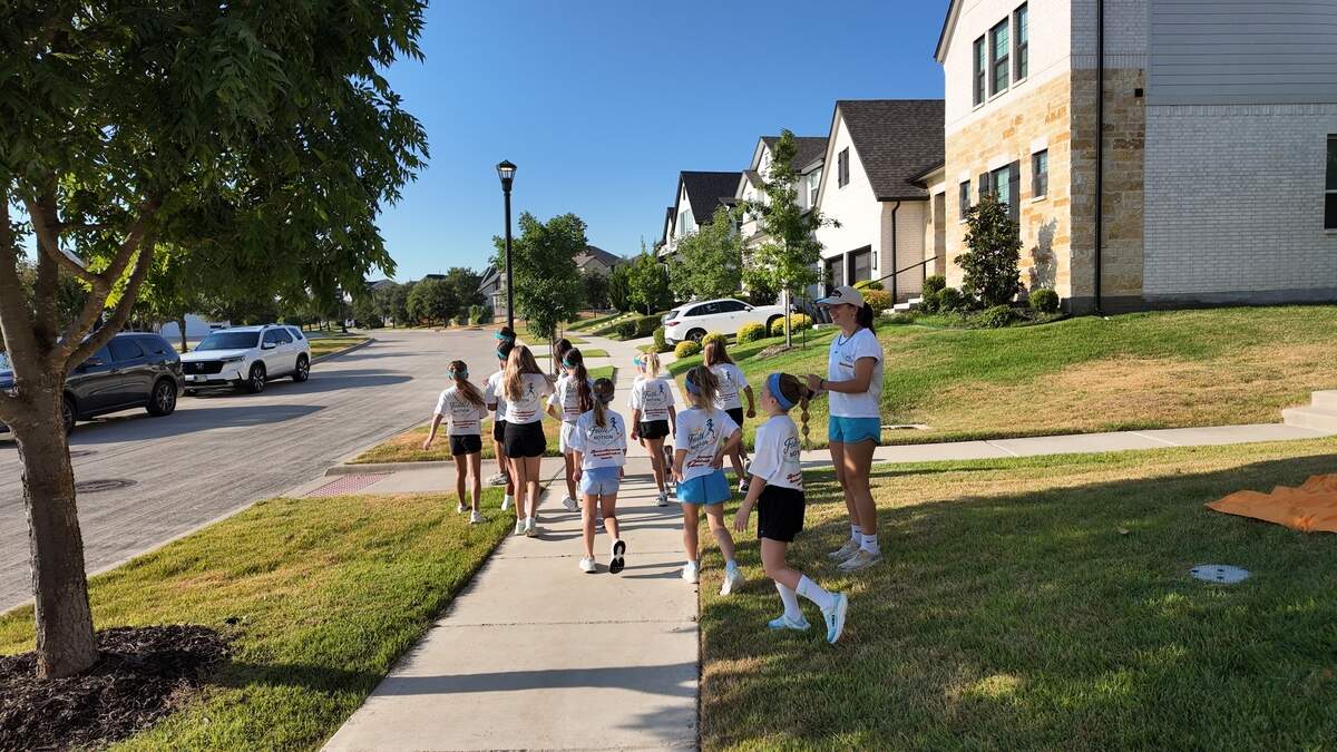 About a dozen elementary- and middle-school-aged girls participate in the Faith in Motion run club on Saturday mornings in Aledo in support of their friends, Delaila and Thylane Lamy. Delaila started the club in honor of her father, Gaylord Lamy, who passed away in March.