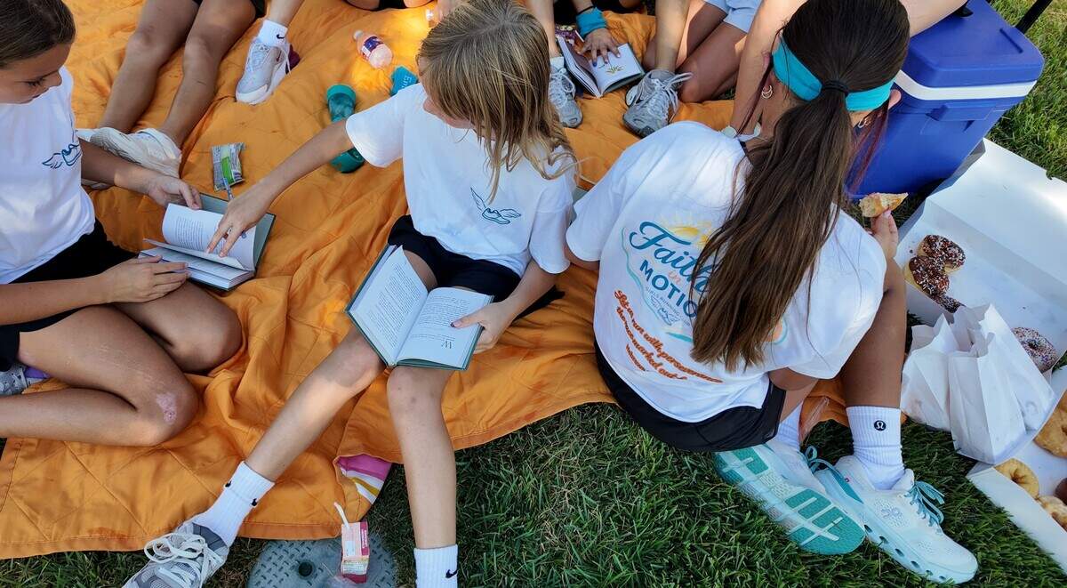 Delaila Lamy leads her junior high friends through a post-run devotional at her Faith in Motion run club on Aug. 29, 2026 in Aledo.