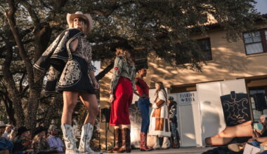 Models made their way down the runway in front of the historic Livestock Exchange Building as golden light filtered through the oaks during Fashion Week Stockyards Style. (Photo by Avin Park Photography)