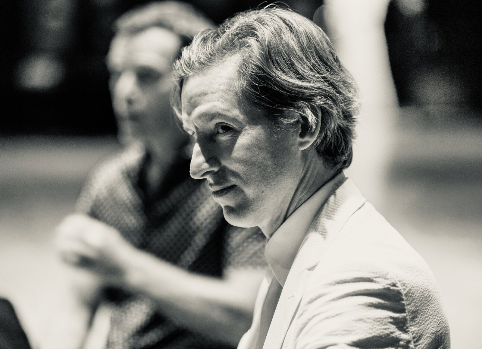 Houston-born filmmaker Wes Anderson shares a candid moment with Q+A moderator and friend MIke Maggart during Arthouse Houston’s Homecoming Soirée to save Garden Oaks Theater. (Photo by Alan Nguyen)