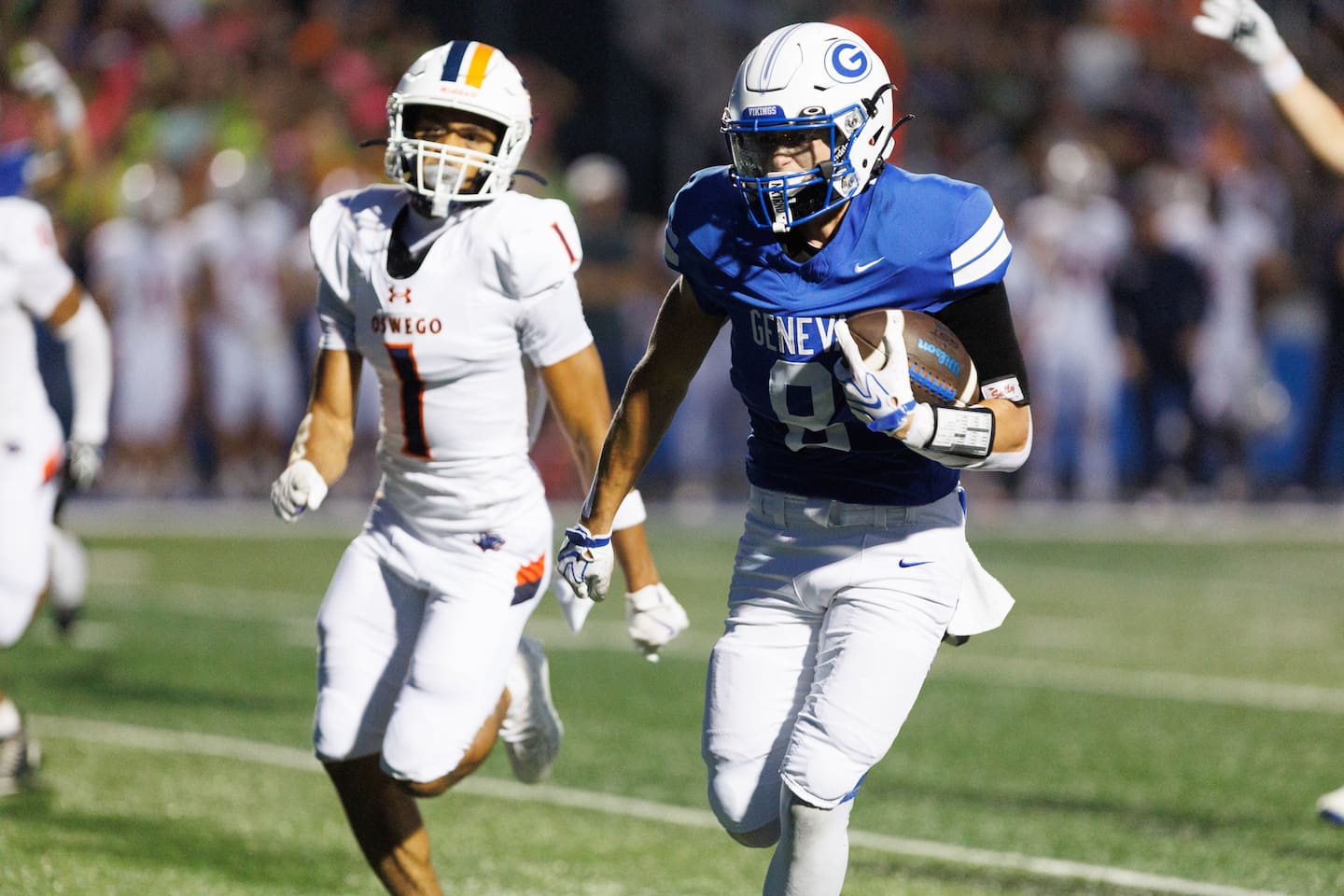 Geneva's Bennett Konkey runs the ball past Oswego's Dontrell Young on Friday, Aug.28,2026 in Geneva.