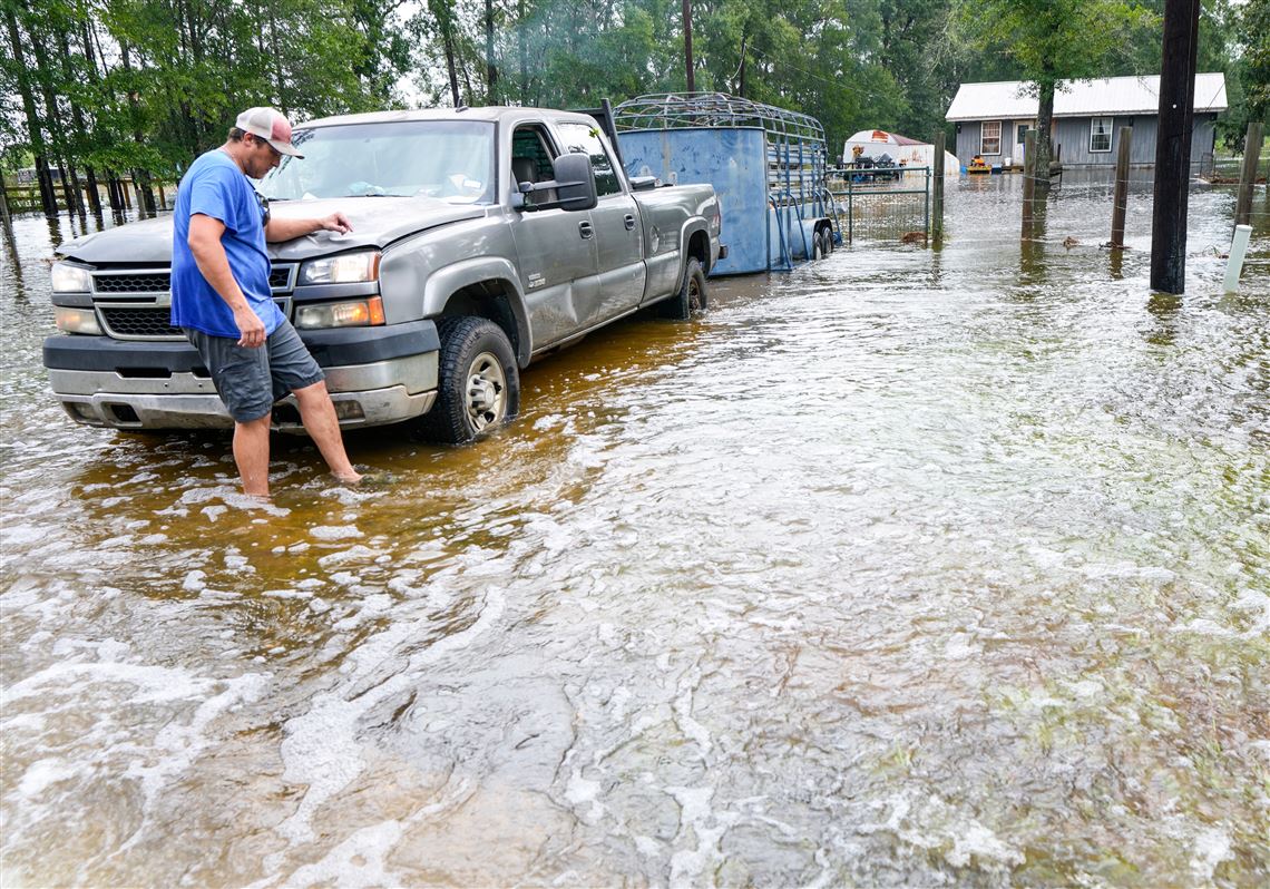 Edouard, now a tropical depression, drenches Texas with flash flooding and downed trees