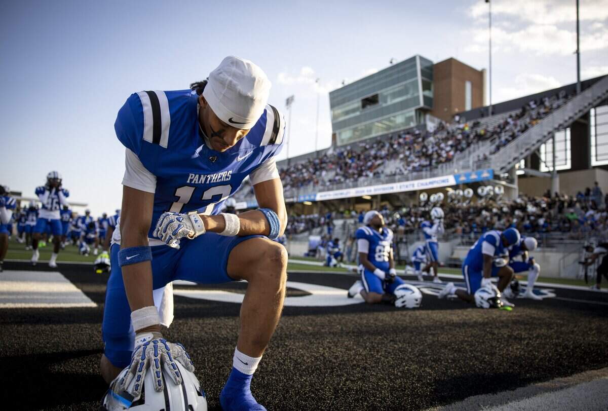 North Crowley linebacker TJ Boyd (13) kneels in prayer before the game against Southlake Carroll on Friday, Sept. 4, 2026 at Crowley ISD Stadium in Fort Worth.