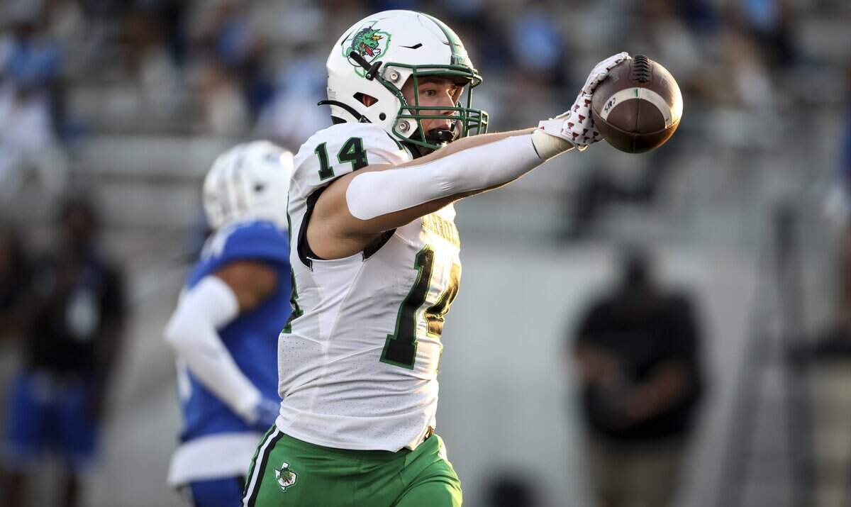 Southlake Carroll tight end Easton Nied (14) scores a touchdown during the first half of the game against North Crowley on Friday, Sept. 4, 2026 at Crowley ISD Stadium in Fort Worth.