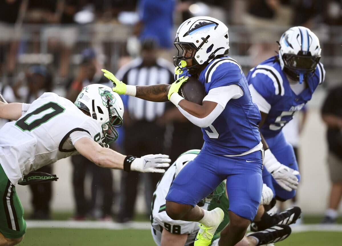 North Crowley running back G’yrell Smith (3) pushes past Southlake Carroll defense during the first half of the game on Friday, Sept. 4, 2026 at Crowley ISD Stadium in Fort Worth.