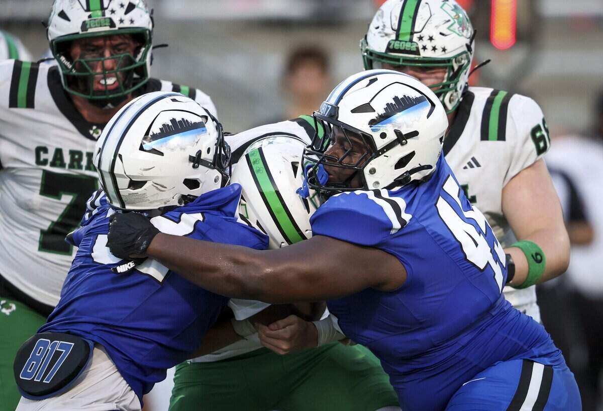 North Crowley defense piles on Southlake Carroll during the first half of the game on Friday, Sept. 4, 2026 at Crowley ISD Stadium in Fort Worth.