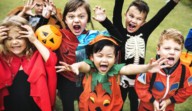 Little kids at a Halloween party. Getty Image.