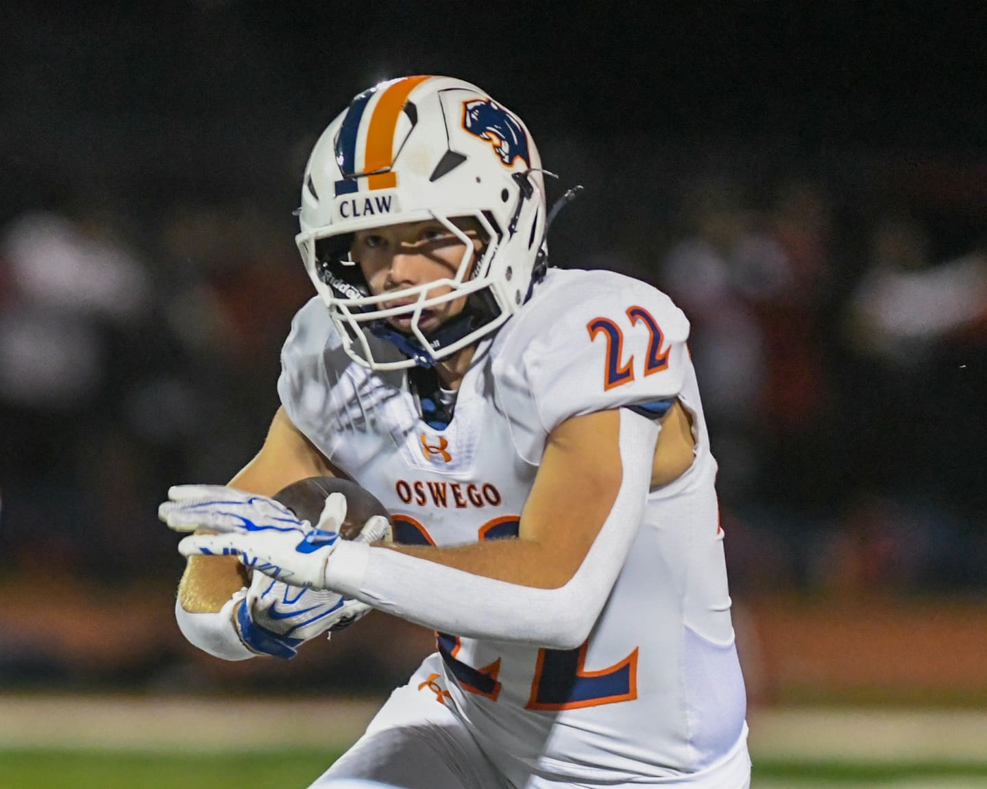 Oswego's Graham Schwab (22) runs the ball during the game on Friday, Sept. 25, 2026, while traveling to take on Yorkville High School.