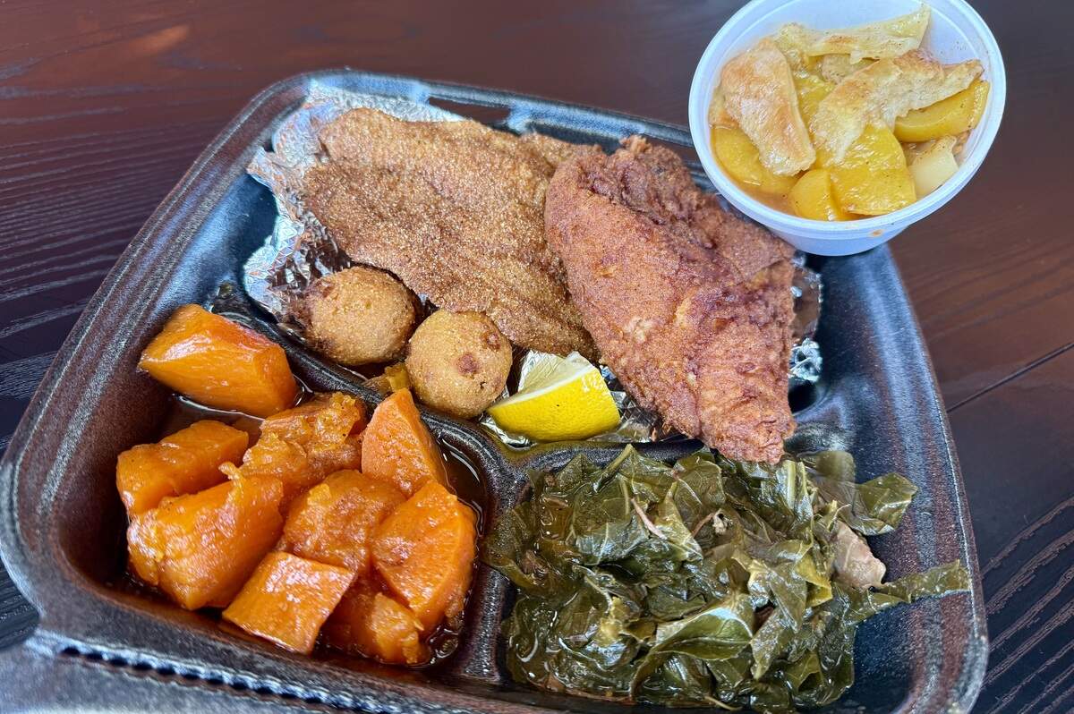 A combo plate with a fried catfish fillet, a fried chicken breast, yams and collard greens at the Peachtree Cafe location in Fort Worth, Texas, seen Aug. 18, 2026.