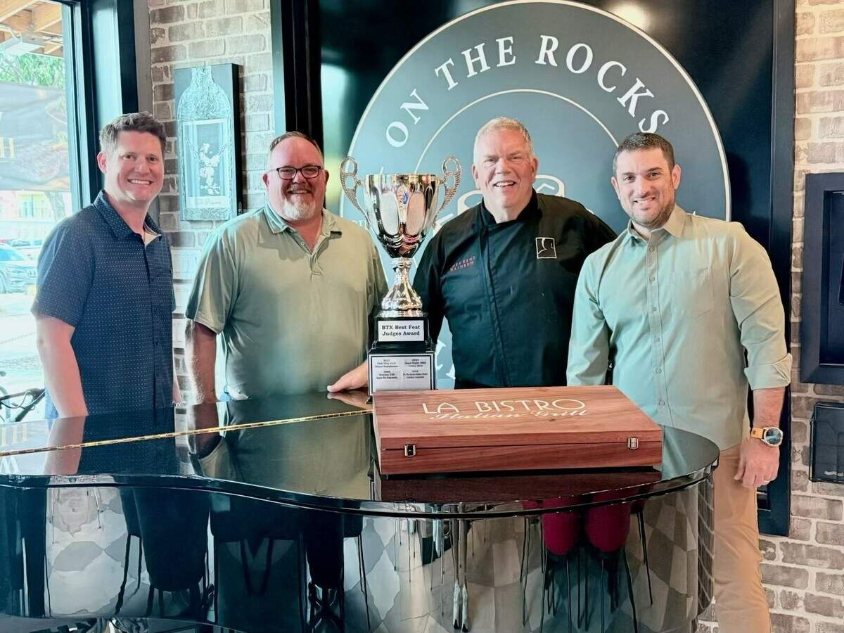 Culinary director Kent Rathbun and On The Rocks owner Jason Benouared, on the right, accepting the BTX Best Fest award for their lobster arancini cappuccino, an ode to Rathbun’s iconic lobster shooter served at the former Abacus restaurant in Dallas.