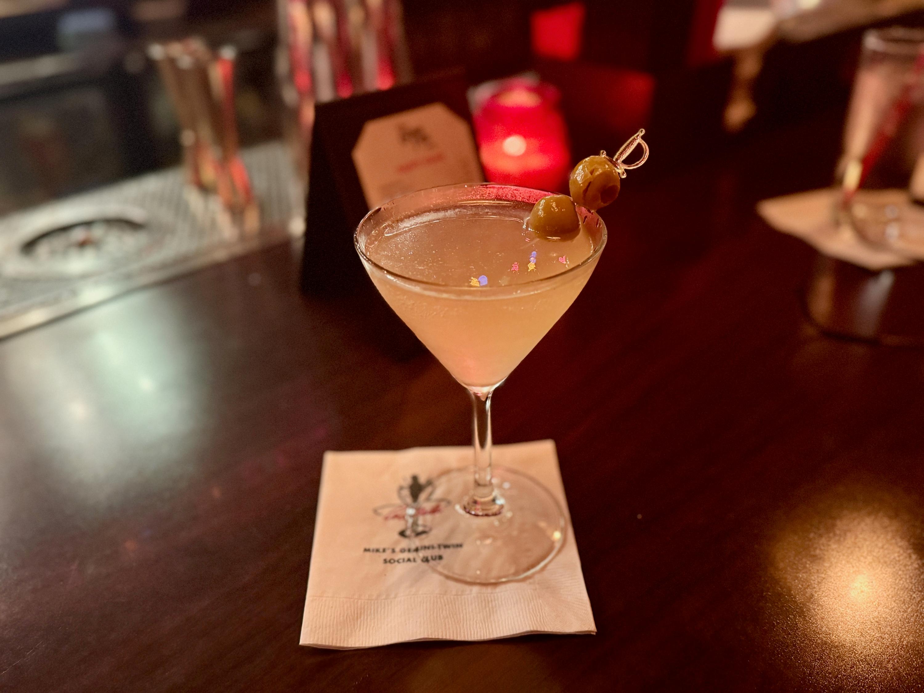a dirty martini on a bar