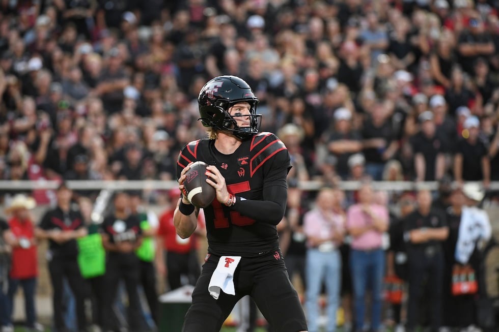 Texas Tech quarterback Will Hammond drops back to throw the ball against Houston during the...