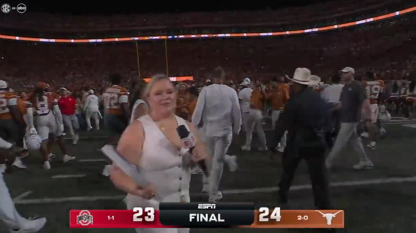 Texas' Steve Sarkisian walks away from ESPN's Holly Rowe, skipping the postgame interview.