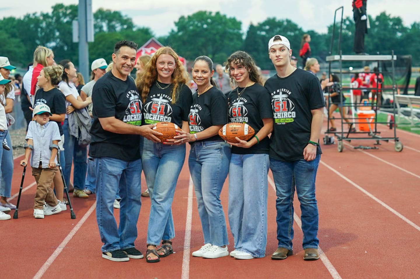Phil LoChirco's family, from left, father Philip, wife Emily, mother Kenia, sister Isabella and brother Giovan pose for a photo during a pregame ceremony honoring LoChirco on Aug. 21, 2026, in Yorkville.