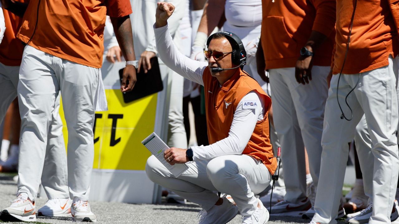 Texas head coach Steve Sarkisian signals to his players during the first half of an NCAA college football game against Ohio State, Saturday, Aug. 30, 2025, in Columbus, Ohio. (AP Photo/Jay LaPrete)