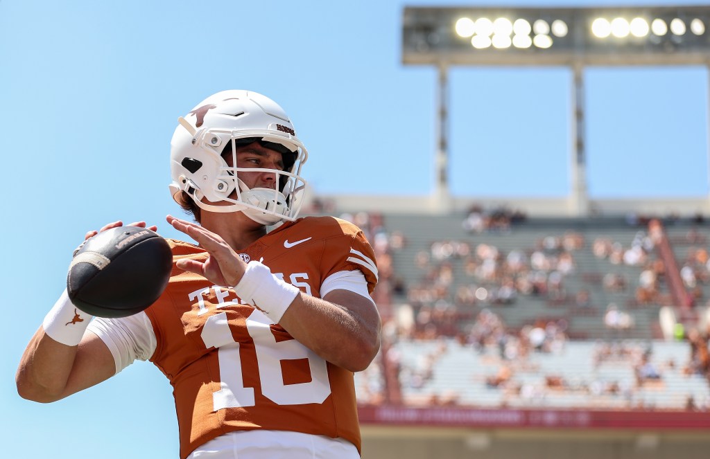 Arch Manning of the Texas Longhorns warms up before a game against the Texas State Bobcats.