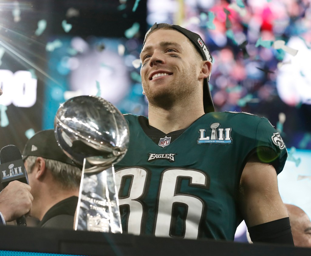 Philadelphia Eagles tight end Zach Ertz holding the Vince Lombardi Trophy after winning Super Bowl LII.
