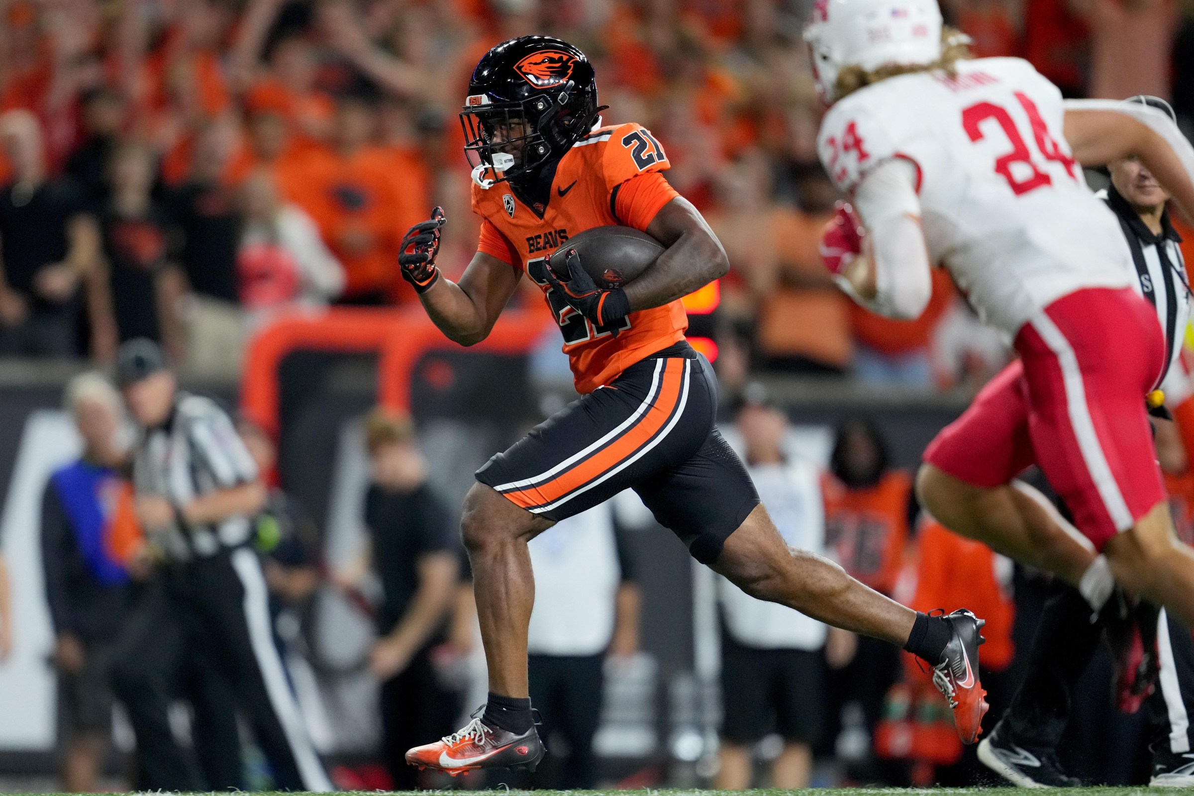 CORVALLIS, OREGON - SEPTEMBER 26: Cornell Hatcher Jr. #21 of the Oregon State Beavers runs with the ball for a touchdown during the second half against the Houston Cougars at Reser Stadium on September 26, 2025 in Corvallis, Oregon. (Photo by Soobum Im/Getty Images)