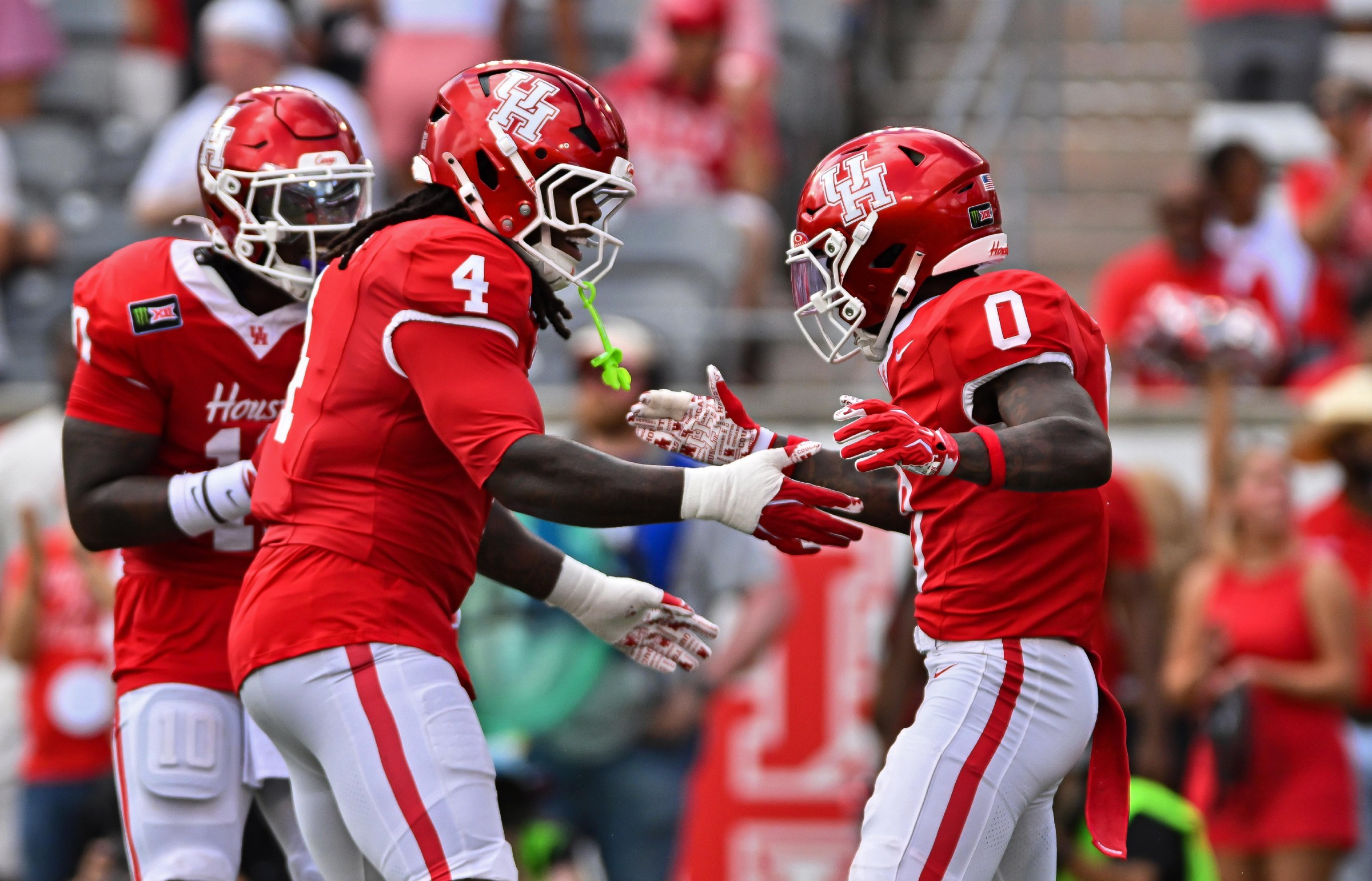 HOUSTON, CA - SEPTEMBER 05: Houston Cougars linebacker Brandon Mack II (4) celebrates with defensive back Javion White (0) after a defensive play during the first quarter of a college football game between the Oregon State Beavers and Houston Cougars on Saturday, September 05, 2026 at TDECU Stadium in Houston, TX. (Photo by Austin McAfee/Icon Sportswire via Getty Images)