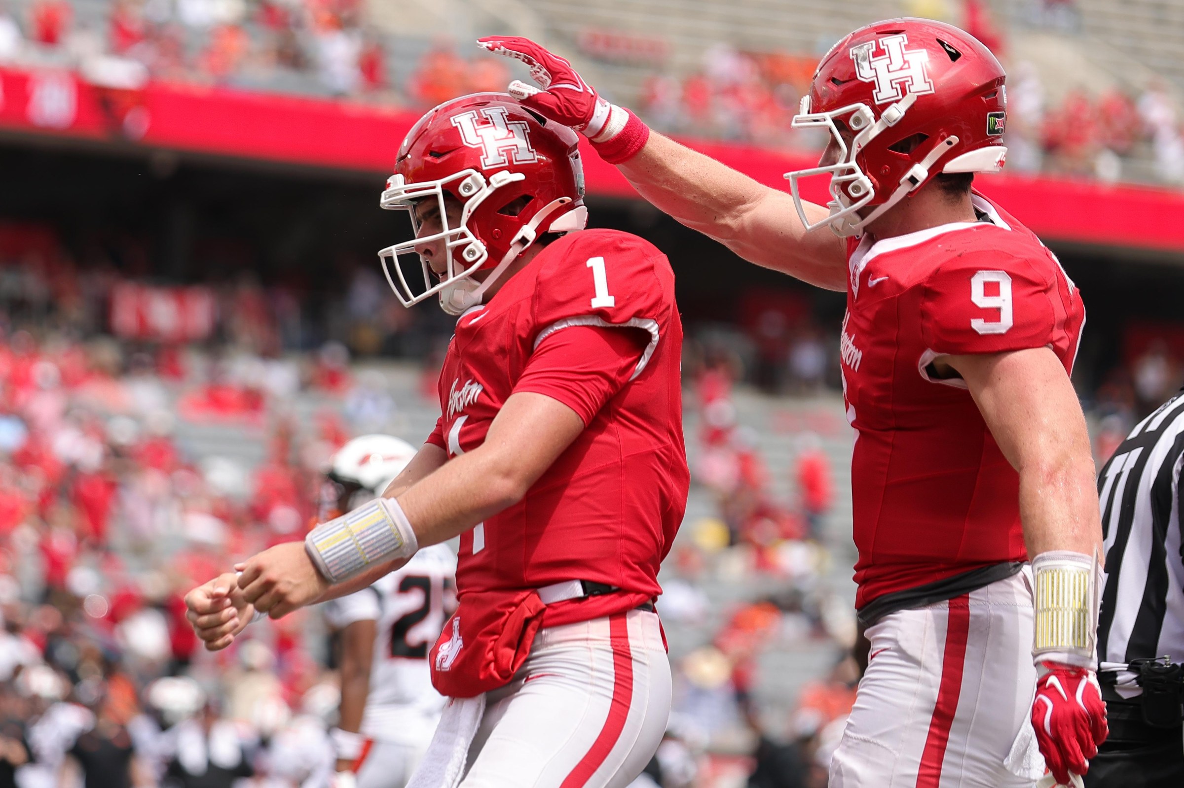 HOUSTON, TEXAS - SEPTEMBER 05: Conner Weigman #1 of the Houston Cougars celebrates his touchdown with Patrick Overmyer #9 of the Houston Cougars during the fourth quarter against the Oregon State Beavers at TDECU Stadium on September 05, 2026 in Houston, Texas. (Photo by Alex Slitz/Getty Images)