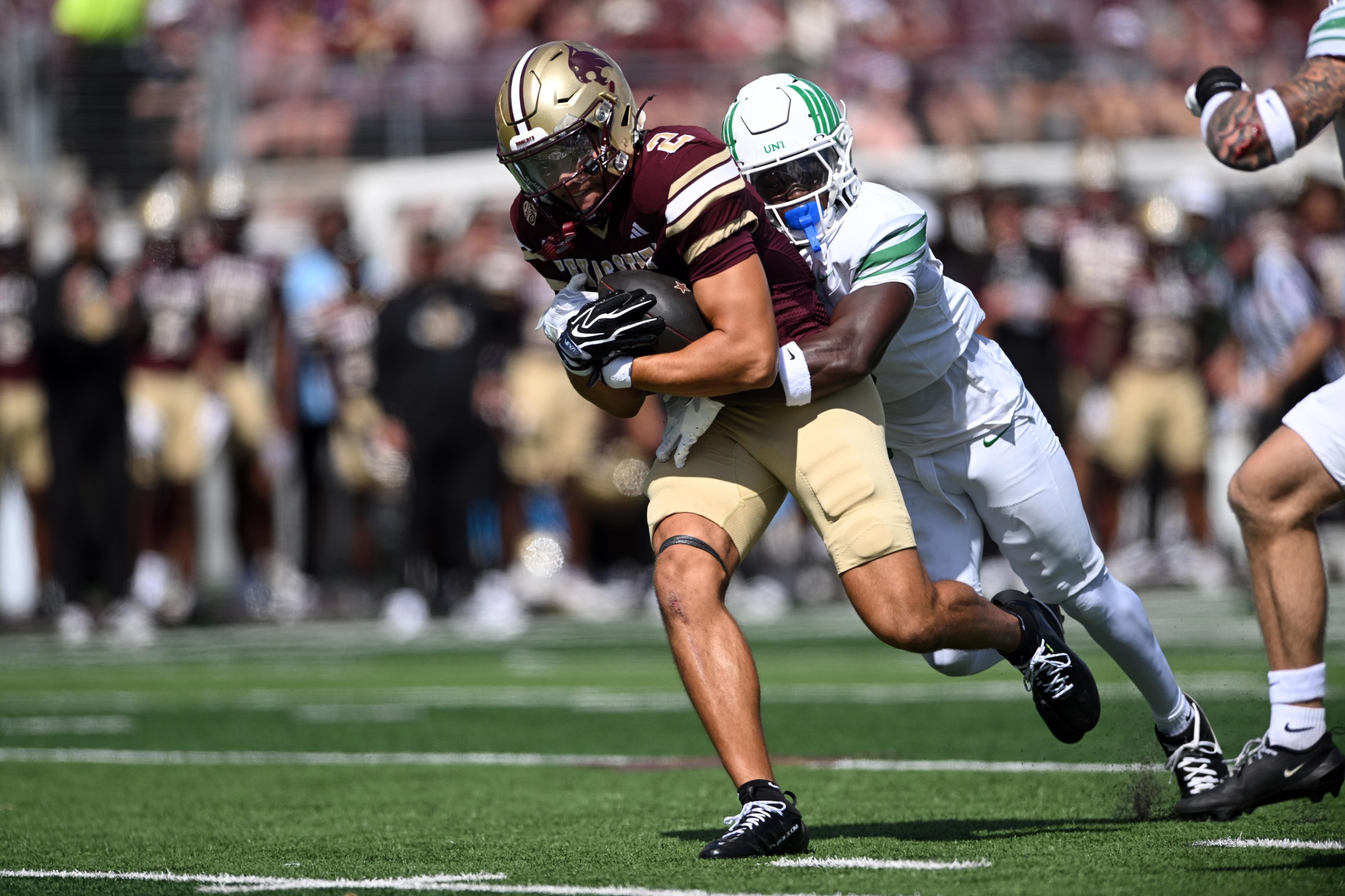 SAN MARCOS, TX - SEPTEMBER 19: Texas State Bobcats WR Kylen Evans (2) gets tackled by North Texas Mean Green DB Brandon Jones (right) during game featuring the North Texas Mean Green and the Texas State Bobcats on September 19, 2026 at UFCU Stadium in San Marcos, TX. (Photo by John Rivera/Icon Sportswire via Getty Images)
