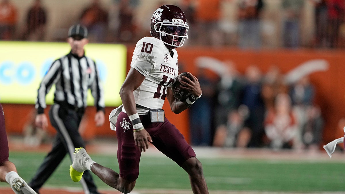 Marcel Reed runs during a Texas A&M football game