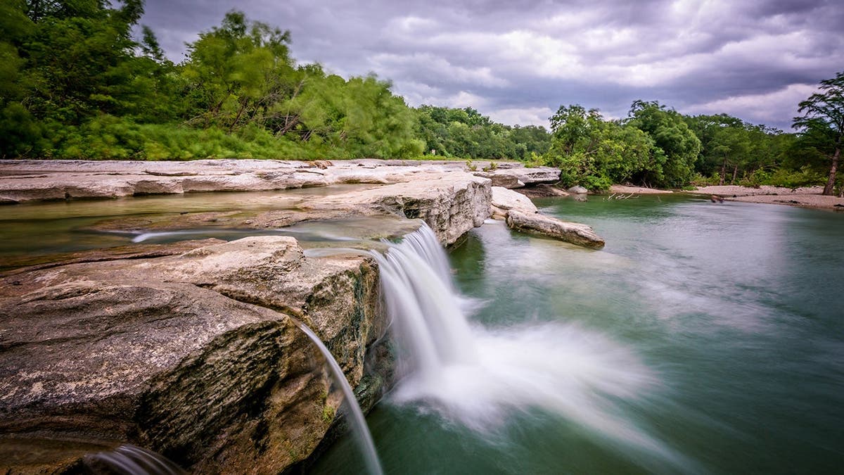 Waterfall cascades at McKinney Falls State Park.