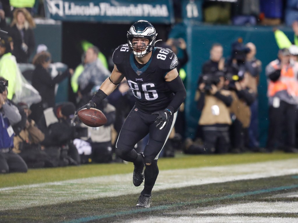 Philadelphia Eagles tight end Zach Ertz runs with the football, celebrating after scoring the game-winning touchdown.