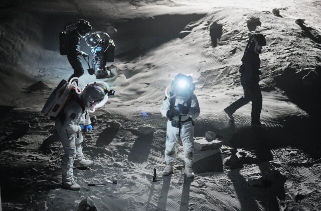 Scientists test newly developed spacesuits at the LUNA analog facility in preparation of future human and robotic missions to the moon, simulating the lunar surface for astronauts and robotic systems for the European Space Agency at the German Aerospace Center near Cologne, Germany, Thursday, Sept. 3, 2026. (AP Photo/Martin Meissner)