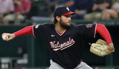 Washington Nationals pitcher Trevor Williams reaches back to deliver in his navy road uniform at Globe Life Field.
