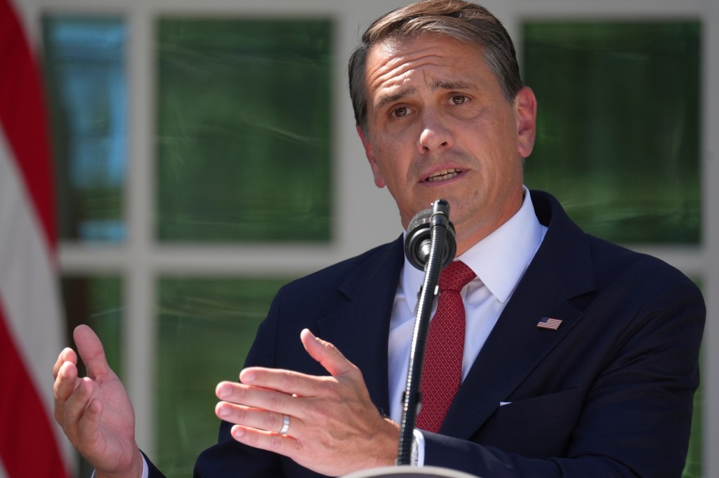 U.S. Attorney General Todd Blanche speaking at a news briefing in the Rose Garden of the White House.