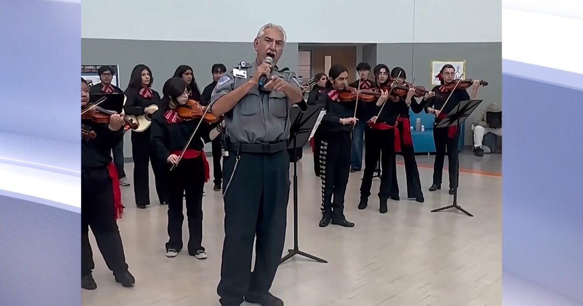 Safety officer's surprise mariachi performance stuns Carroll High students