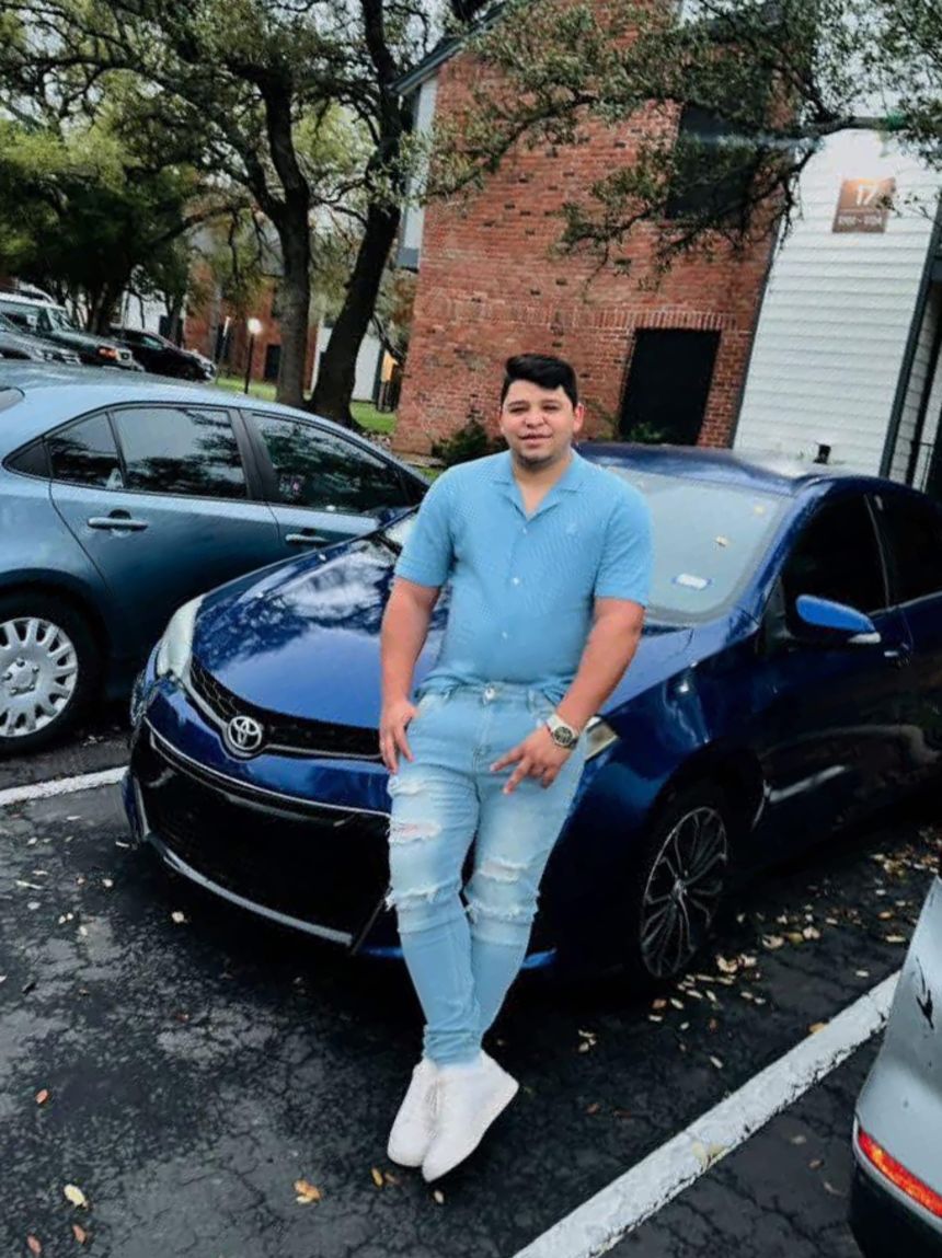Wilber Rafael Garces Perez, 28, the man who was shot and injured by an Immigration and Customs Enforcement agent on September 20, is shown standing by his car, which was damaged in the shooting.