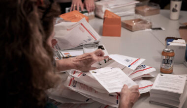 Massachusetts Medication Abortion Access Project volunteers pack envelopes with medication and information. (Robin Lubbock/WBUR)
