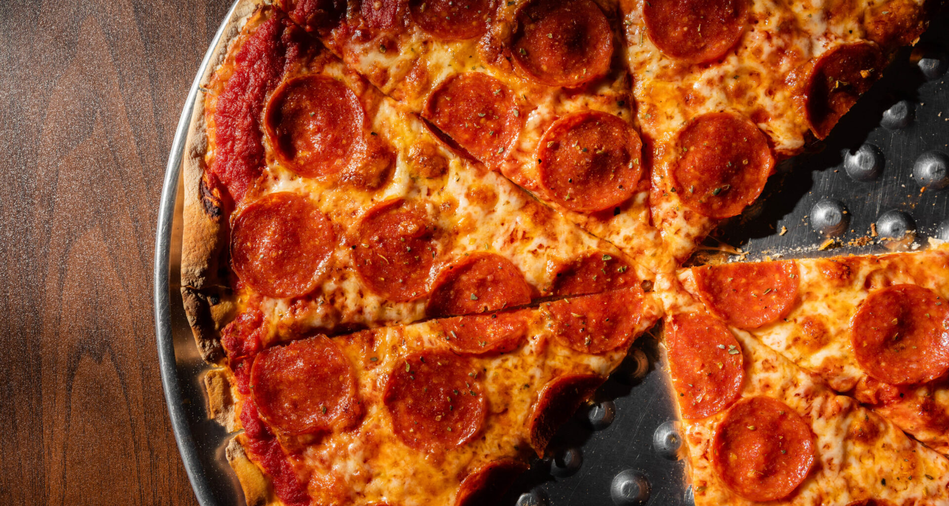 His parents ran Pizza by Marco. Now, he’s keeping their legacy alive in our neighborhood with Ghost Pizza.