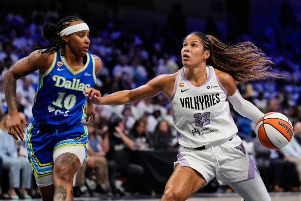 Golden State Valkyries guard Veronica Burton (22) works to the basket as Dallas Wings guard Aziaha James (10) defends in the first half of a WNBA basketball first-round playoff game Wednesday Sept. 30, 2026, in Arlington, Texas. (AP Photo/Tony Gutierrez)