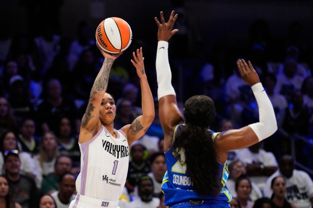 Golden State Valkyries forward Gabby Williams (1) shoots over Dallas Wings' Arike Ogunbowale, right, in the first half of a WNBA basketball first-round playoff game Wednesday Sept. 30, 2026, in Arlington, Texas. (AP Photo/Tony Gutierrez)