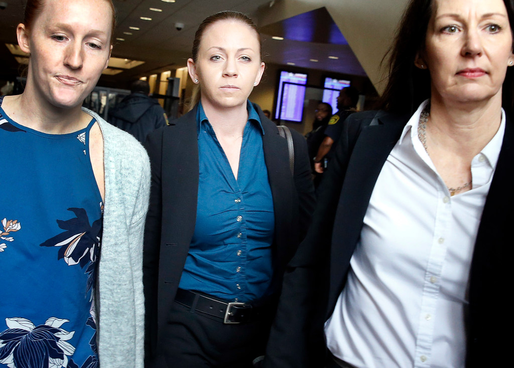 Former Dallas police Officer Amber Guyger (center) leaves the Frank Crowley Courts Building in downtown Dallas.