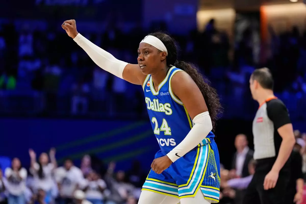 Dallas Wings' Arike Ogunbowale celebrates a basket in the second half of a WNBA basketball first-round playoff game against the Golden State Valkyries Wednesday Sept. 30, 2026, in Arlington, Texas. (AP Photo/Tony Gutierrez)