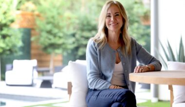 Slot Machines in McCarran International Airport. Passengers leaving Las Vegas walking through the airport, some playing on slots.
