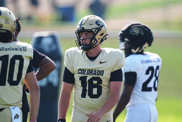Colorado quarterback Isaac Wilson waits to take part in drills during a practice at an NCAA college football training camp in Fountain, Colo., Thursday, Aug. 6, 2026. (AP Photo/David Zalubowski)
