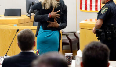 Botham Jean's younger brother Brandt Jean hugs former Dallas officer Amber Guyger after delivering his impact statement to her following her 10-year prison sentence for murder.