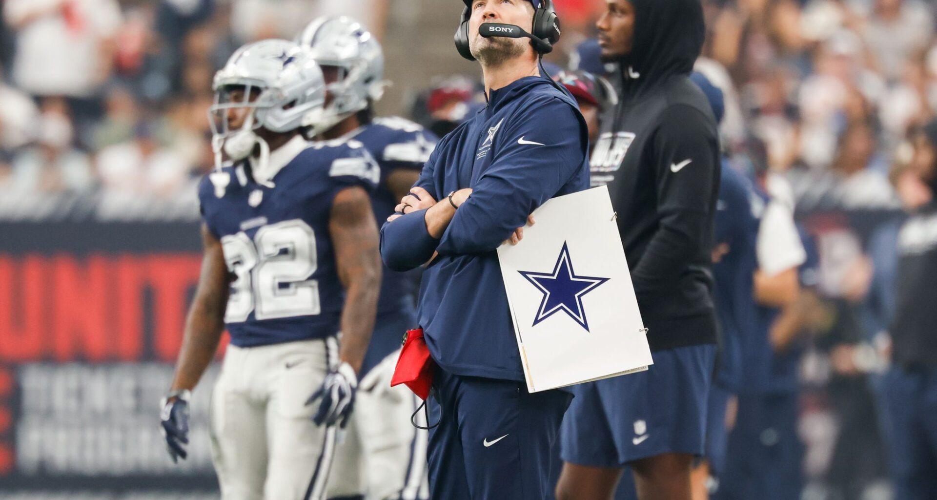 Dallas Cowboys head coach Brian Schottenheimer watches as his team warms up before an NFL football game against the Houston Texans at Reliant Stadium in Houston, Sunday, Oct. 4, 2026.