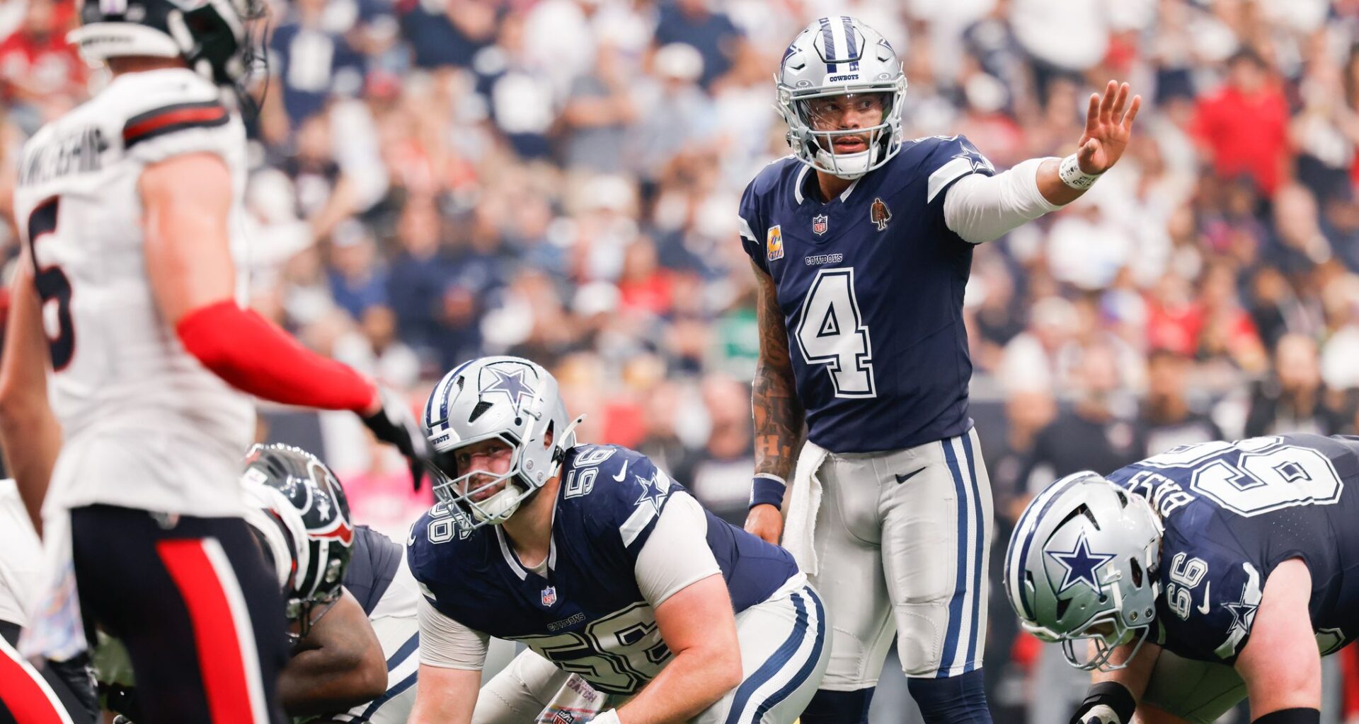 Dallas Cowboys running back Javonte Williams (33) celebrates his touchdown run with Dallas Cowboys head coach Brian Schottenheimer during the fourth quarter of an NFL football game against the Houston Texans at Reliant Stadium in Houston, Sunday, Oct. 4, 2026.